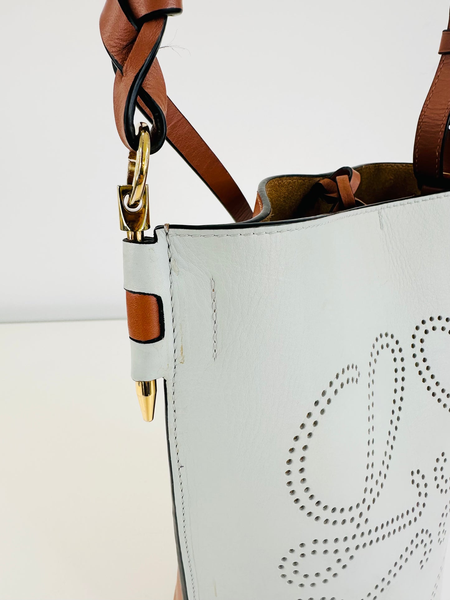 Gate Anagram Perforated Leather Bucket Bag