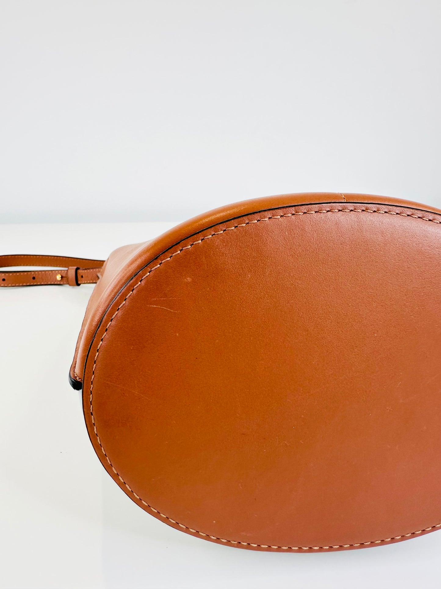 Gate Anagram Perforated Leather Bucket Bag